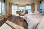 The master has a queen bed with gorgeous panoramic views of the pacific ocean.